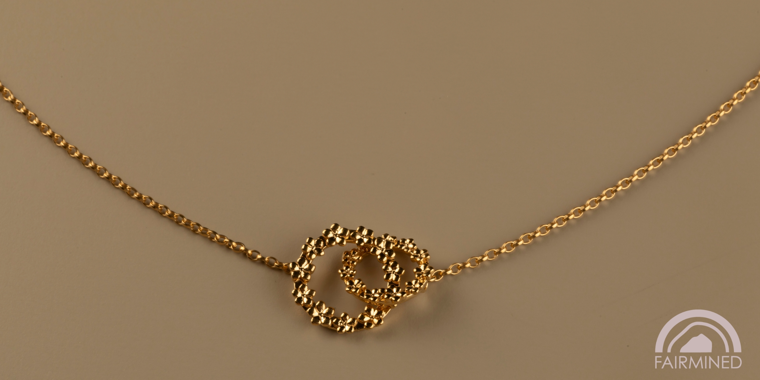 The Forget-Me-Not 'Wreath' Silver Love Link Necklace layered in 18-carat Fairmined Gold