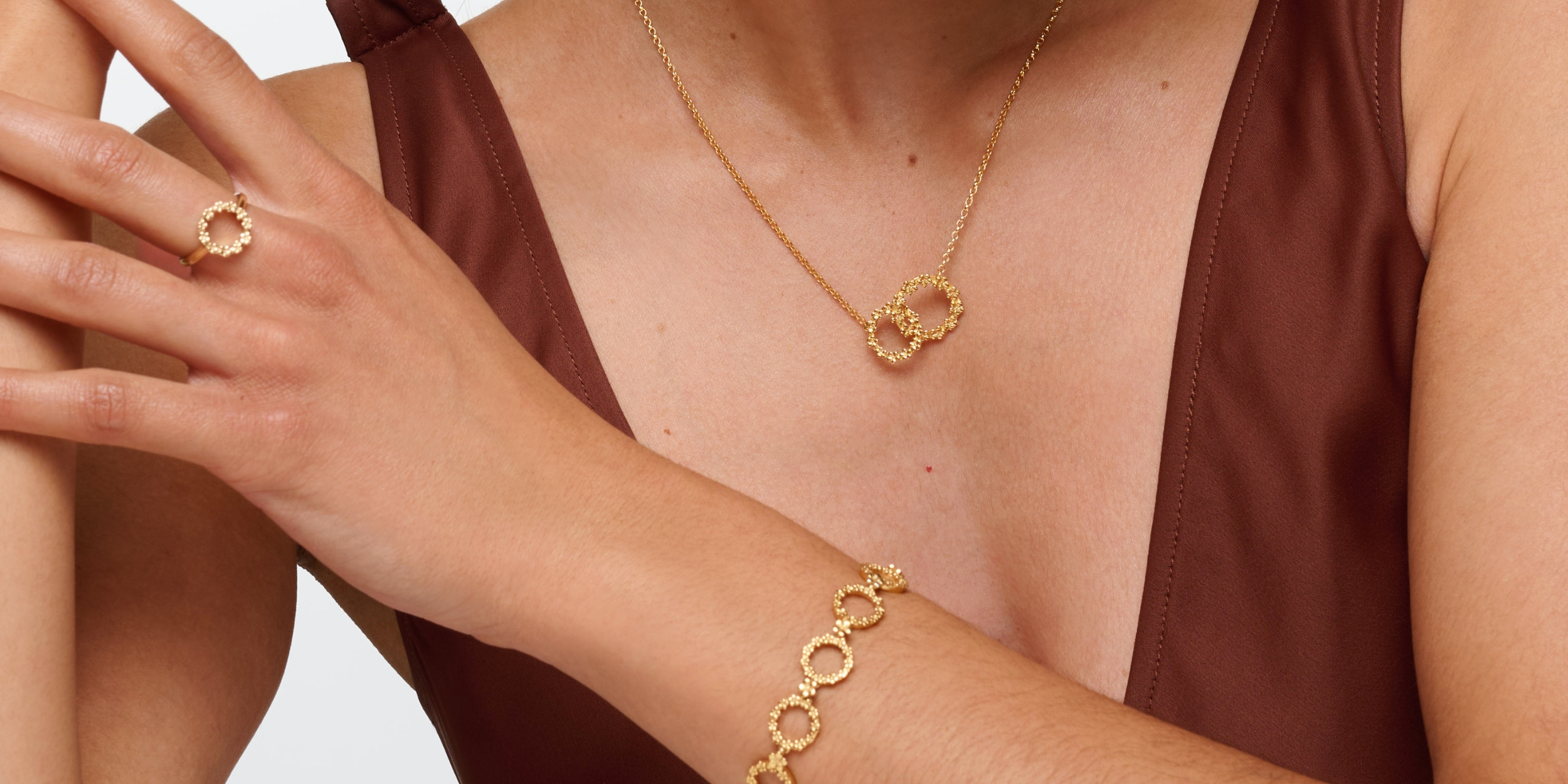 The Forget-Me-Not 'Wreath' Silver Love Link Necklace layered in 18-carat Fairmined Gold